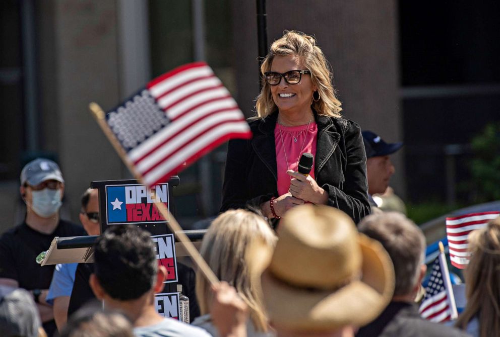 PHOTO: Shelley Luther, the owner of the Dallas hair salon "Salon a la Mode" speaks to a crowd of supporters at an "Open Texas" rally against coronavirus (COVID-19) pandemic restrictions outside of the City Hall in Frisco, Texas, April 25, 2020.