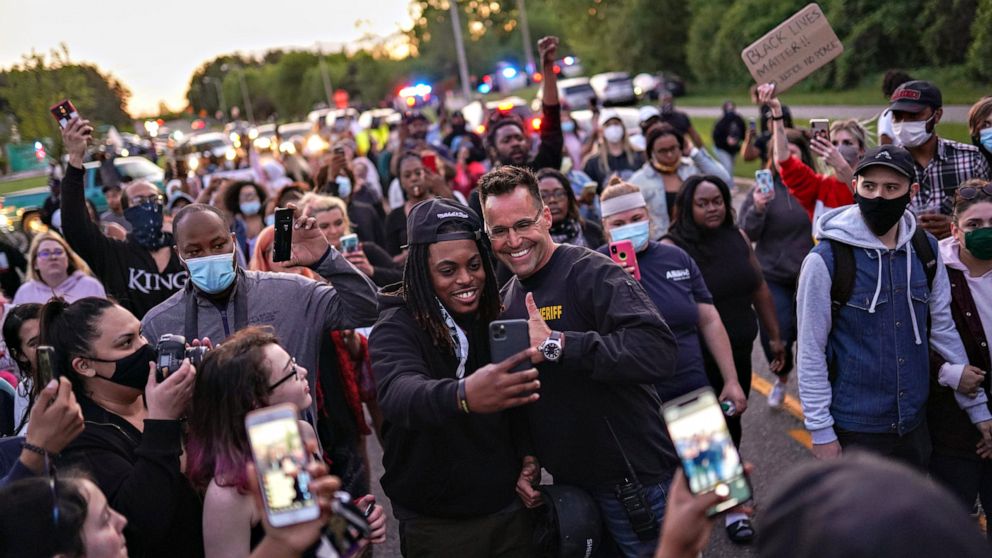 PHOTO: Johnie Franklin of Flint Township, Mich., takes a selfie with Genesee County Sheriff Chris Swanson on May 30, 2020.
