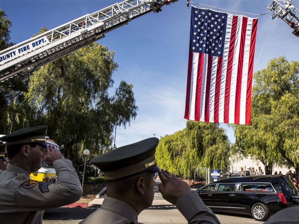 PHOTO: A hearse carrying the coffin of Ventura County Sheriff Sgt. Ron Helus is driven into The Calvary Community Church for his memorial service, Nov. 15, 2018, in Westlake, Calif.