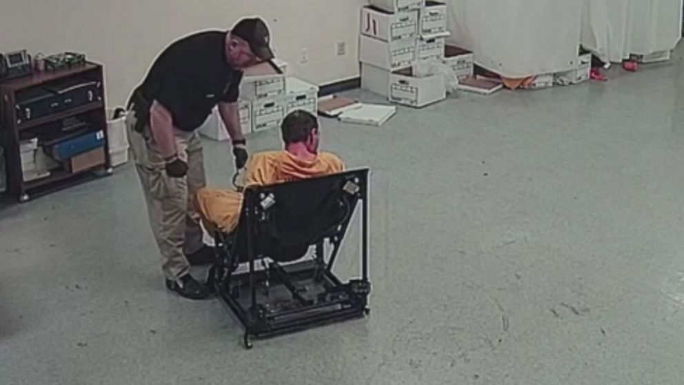 PHOTO: In this screen grab taken from a video, Pike County Deputy Jeremy Mooney is shown with restrained prisoner, Thomas Friend. 