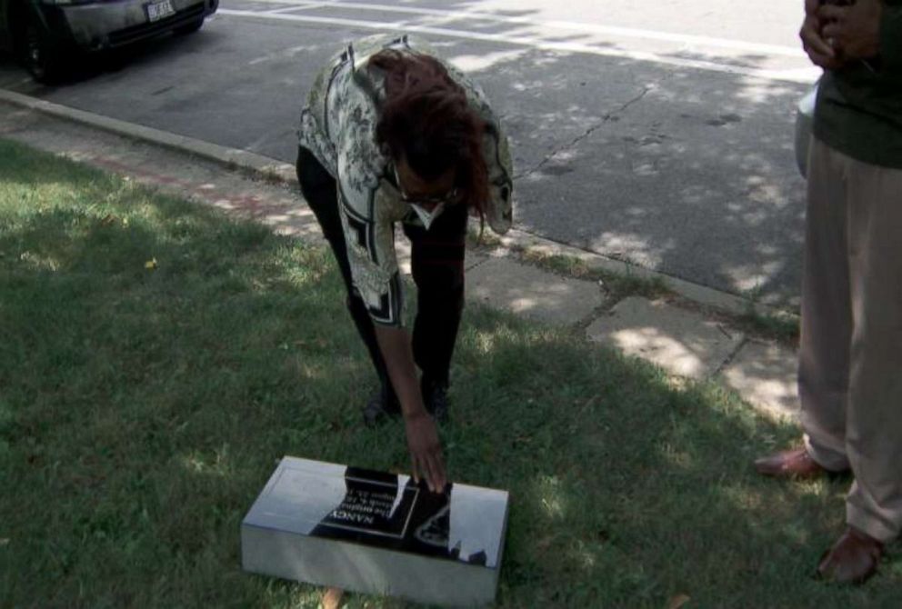 PHOTO: Sherry Williams gets a first look at headstone she has fought more than a decade to get made.