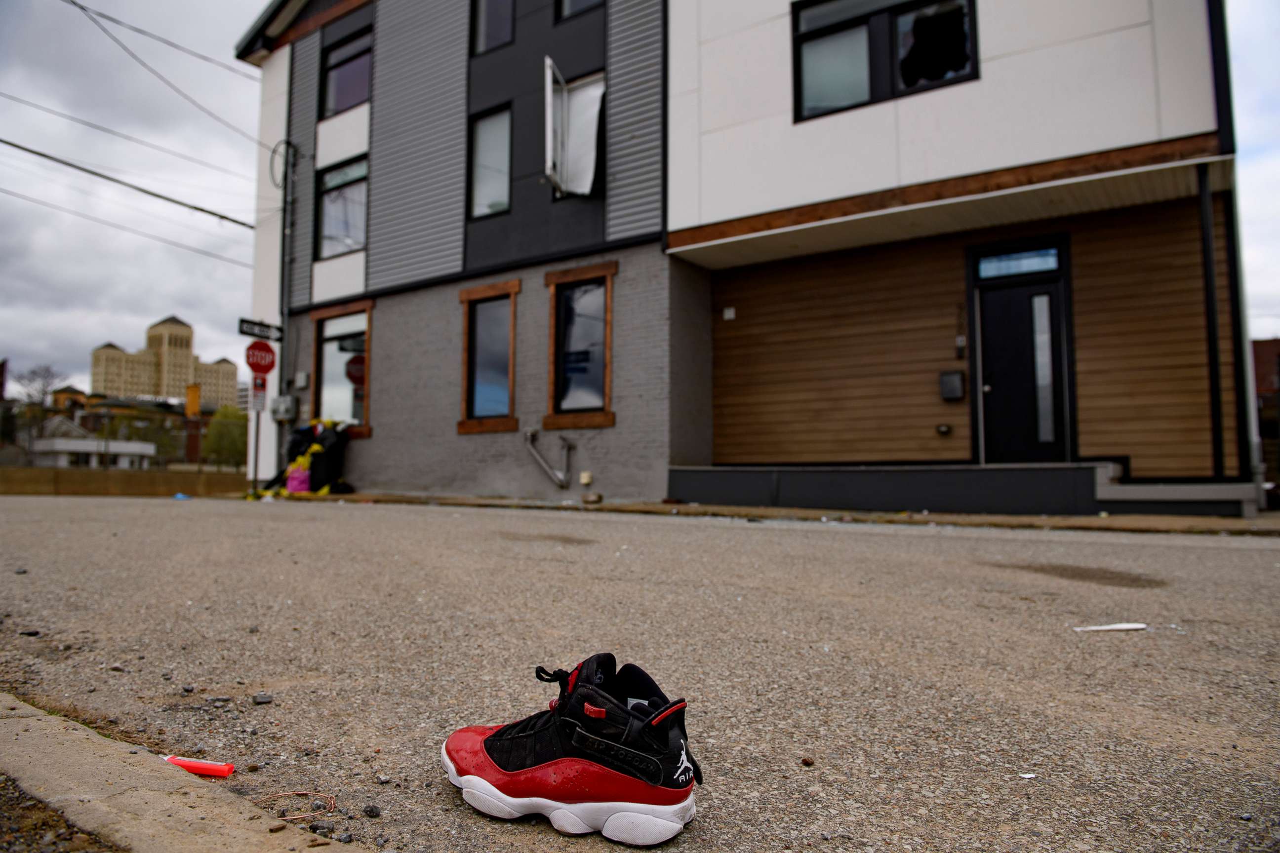 PHOTO: A shoe is seen outside a Pittsburgh Airbnb apartment rental, April 17, 2022, following a shooting during a house party.