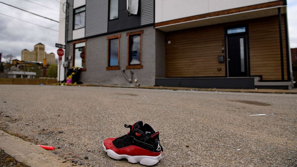 PHOTO: A shoe is seen outside a Pittsburgh Airbnb apartment rental, April 17, 2022, following a shooting during a house party.