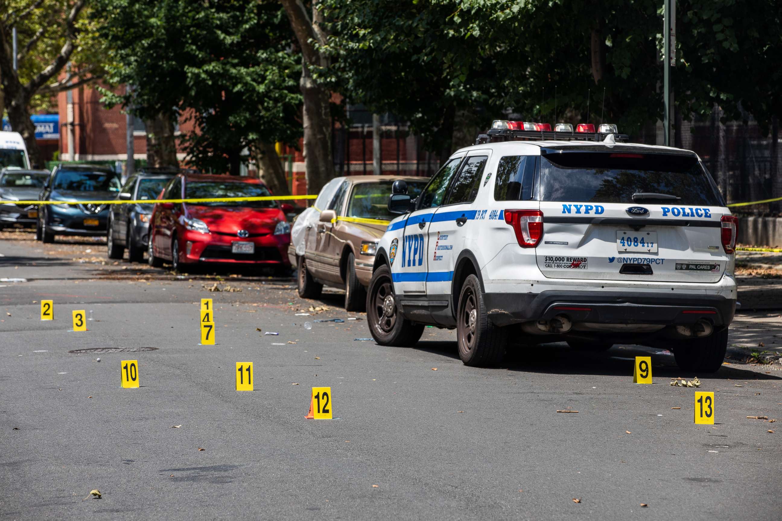 PHOTO: Evidence markers in the street outside of Raymond Bush Playground in Brooklyn, on Monday, July 13, 2020.