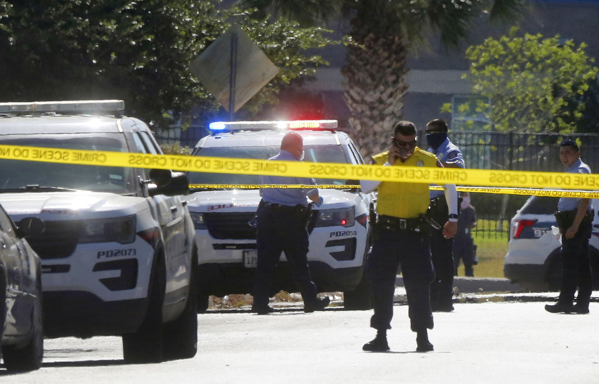 PHOTO: McAllen Police officers investigate a shooting that left two fellow officers dead after they reportedly responded to a disturbance call, July 11, 2020, in McAllen, Texas.