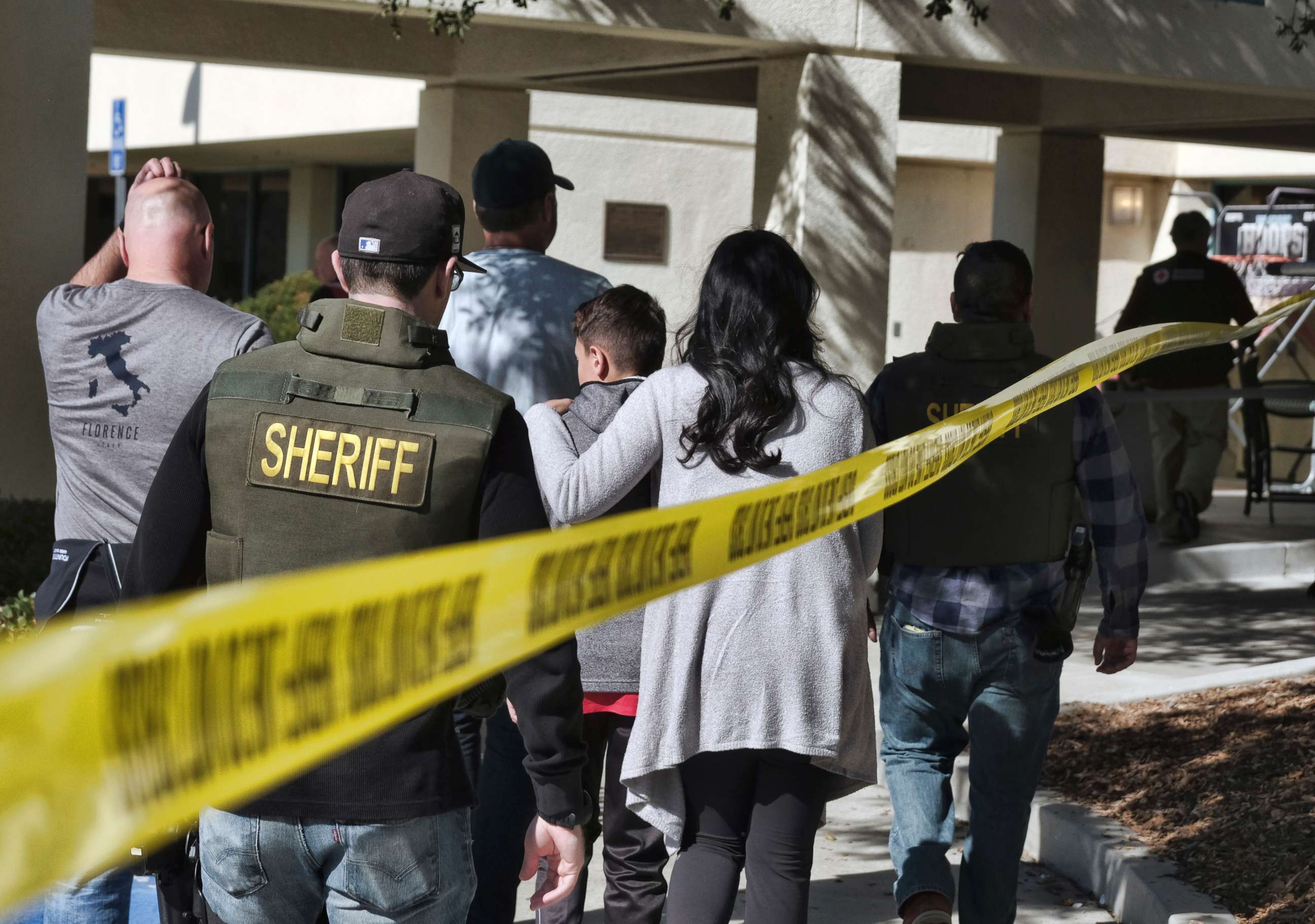 PHOTO: Family members are led into the Thousand Oaks Teen Center where families have gathered after a deadly shooting at a bar in Thousand Oaks, Calif., Nov. 8, 2018. 