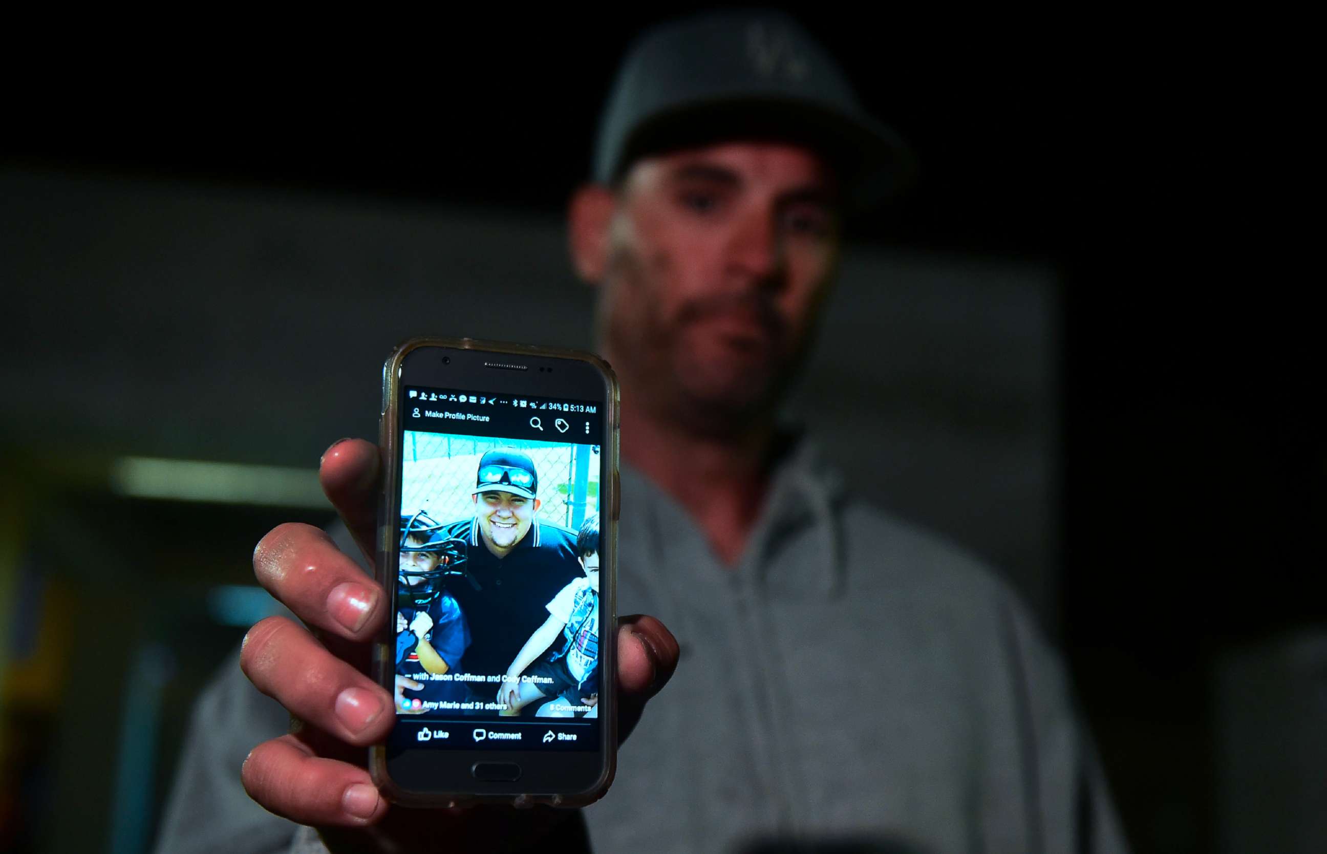 PHOTO: Jason Coffman displays a photo of his son Cody outside the Thousands Oaks Teene Center where he came hoping to find his son who was at the Borderline Bar and Grill in Thousand Oaks, Calif., Nov.8, 2018. 