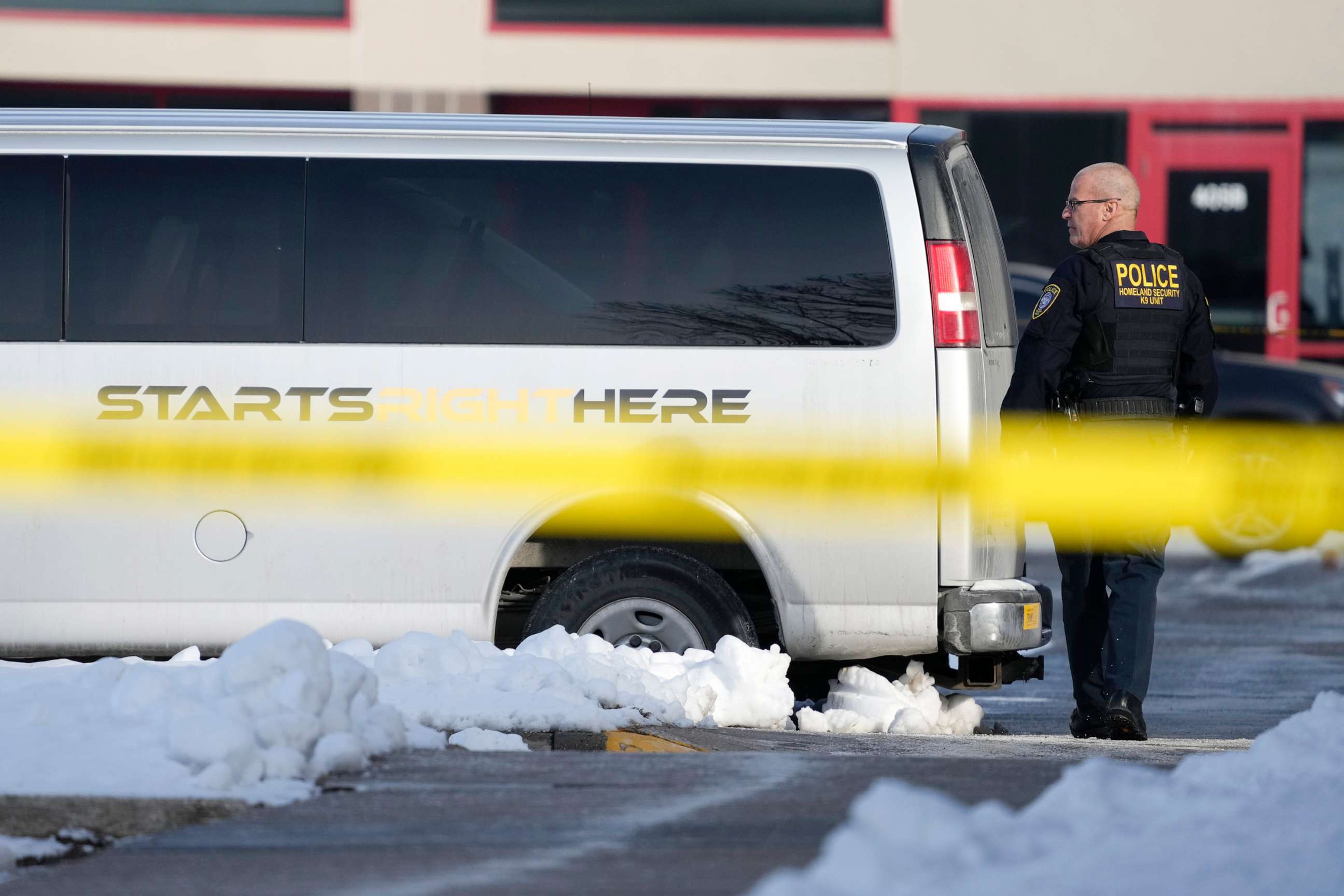 PHOTO: A law enforcement officer walks outside the Starts Right Here building, Jan. 23, 2023, in Des Moines, Iowa. Police say two students were killed and a teacher was injured in a shooting at the Des Moines school on the edge of the city's downtown.