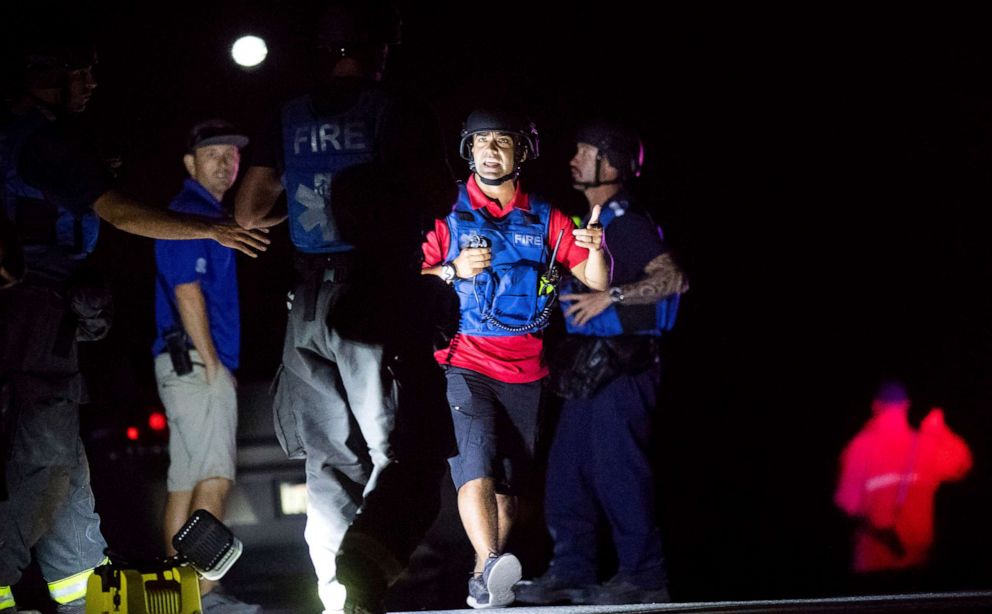 PHOTO: Emergency responders confer at Christmas Hill Park following a deadly shooting during the Gilroy Garlic Festival, in Gilroy, Calif., July 28, 2019.