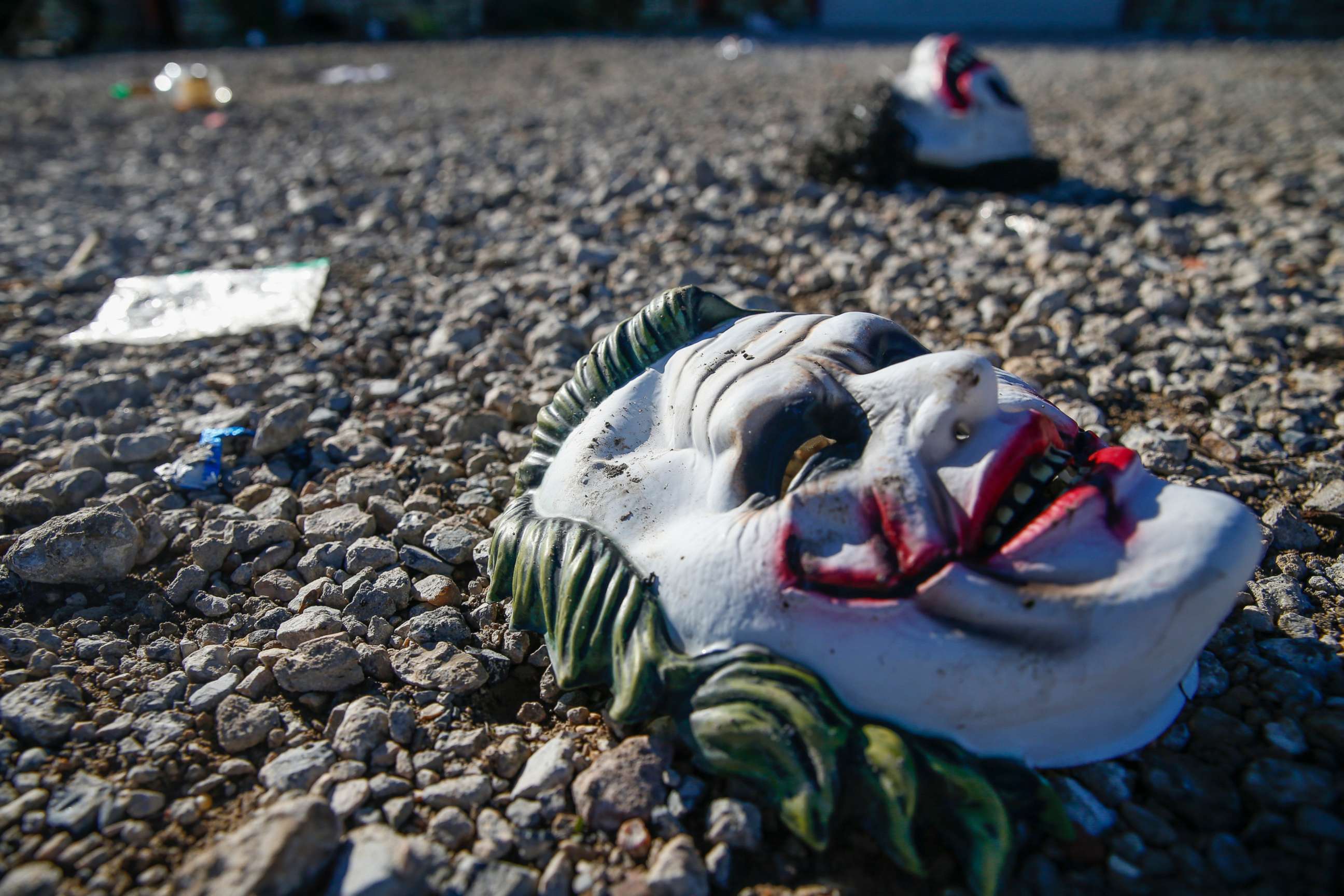 PHOTO: Halloween masks litter the ground amongst signs of chaos at the scene of a deadly shooting in Greenville, Texas, on Oct. 27, 2019.