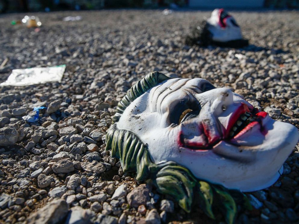 PHOTO: Halloween masks litter the ground amongst signs of chaos at the scene of a deadly shooting in Greenville, Texas, on Oct. 27, 2019.