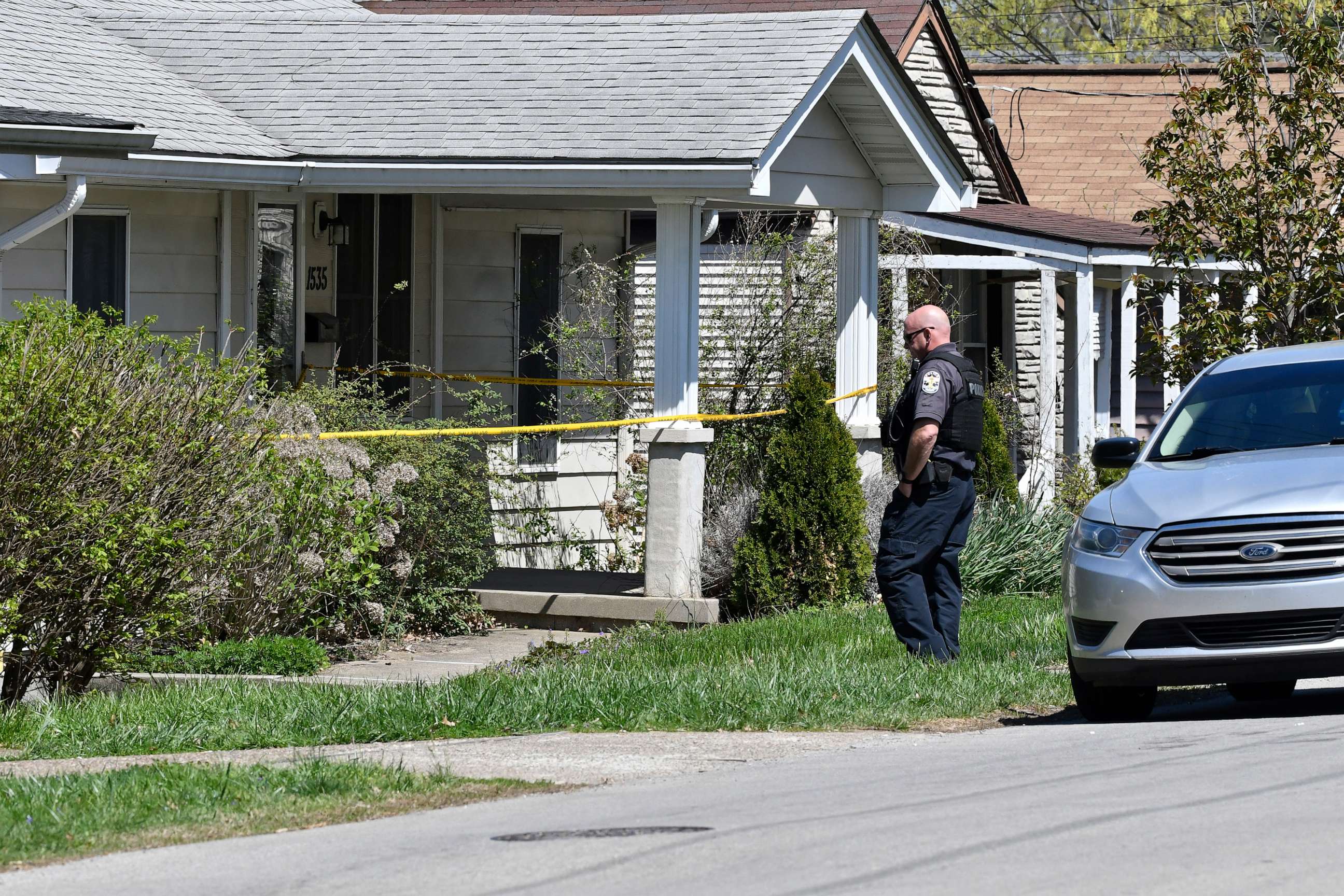 PHOTO: A Louisville Metro Police officer stands outside of the home of the suspected shooter in the Camp Taylor neighborhood in Louisville, Ky., April 10, 2023.