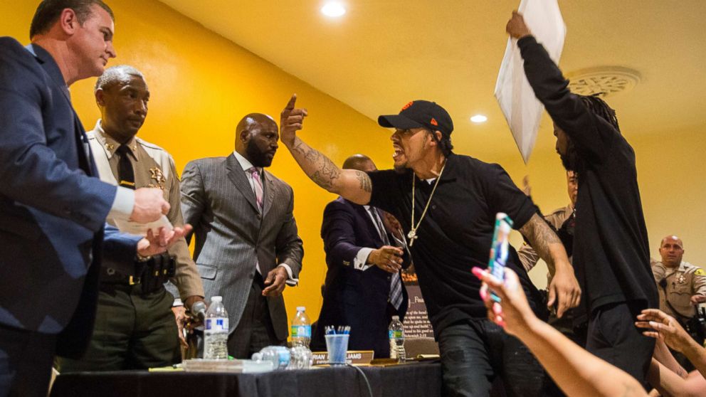 John Weber, older brother of Anthony Weber, climbs on stage yelling at members of the Sheriff Civilian Oversight Commission during an emergency town hall meeting on Feb. 07, 2018 in Los Angeles.