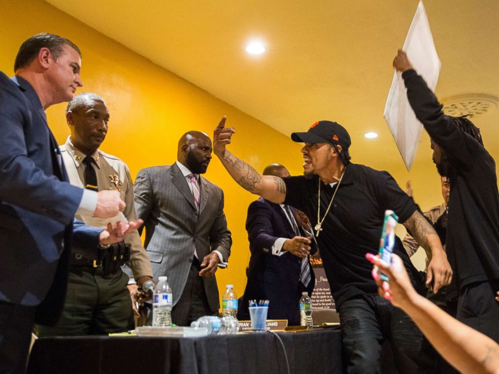 PHOTO: John Weber, older brother of Anthony Weber, climbs on stage yelling at members of the Sheriff Civilian Oversight Commission during an emergency town hall meeting on Feb. 07, 2018 in Los Angeles.