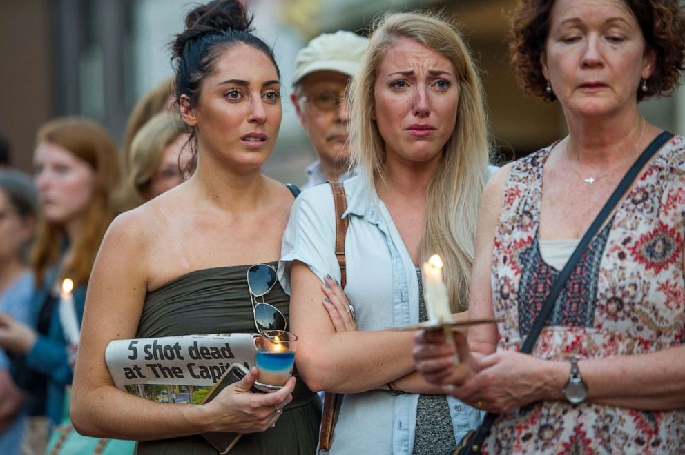 PHOTO: People march during a candle light vigil to remember the five journalists from The Capital Gazette newspaper in Annapolis, Md., June 29, 2018.