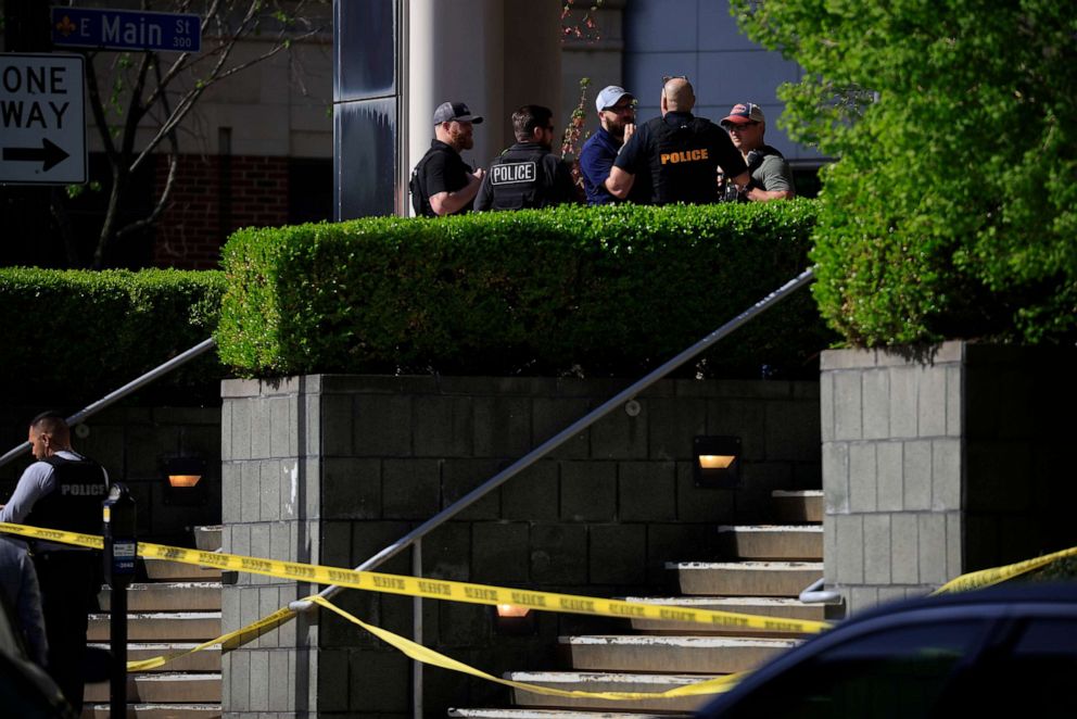 PHOTO: Law enforcement officers gather outside the front entrance of the Old National Bank building after a gunman opened fire on April 10, 2023 in Louisville, Ky.