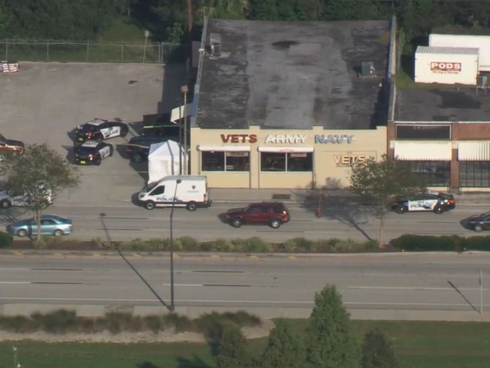 PHOTO: Police at the scene of a shooting at Vets Army Navy Surplus store in Lakeland, Florida on October 3, 2018.