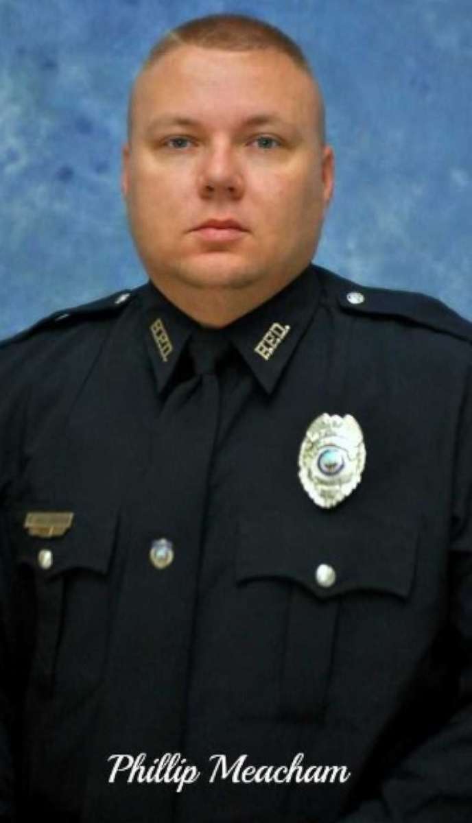 Officer Phillip Meacham died at a hospital late Thursday after he was shot by a suspect.