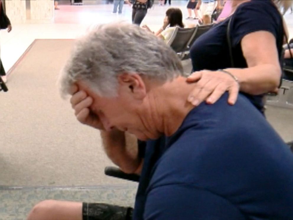 PHOTO: Edward Potter is overcome with emotion as he leaves Tampa International Airport.