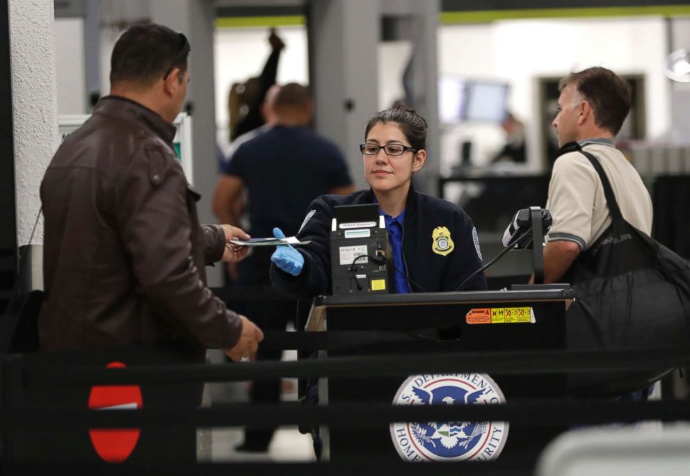 PHOTO: A Transportation Security Administration officer works at a checkpoint at Miami International Airport, Jan. 6, 2019, in Miami.