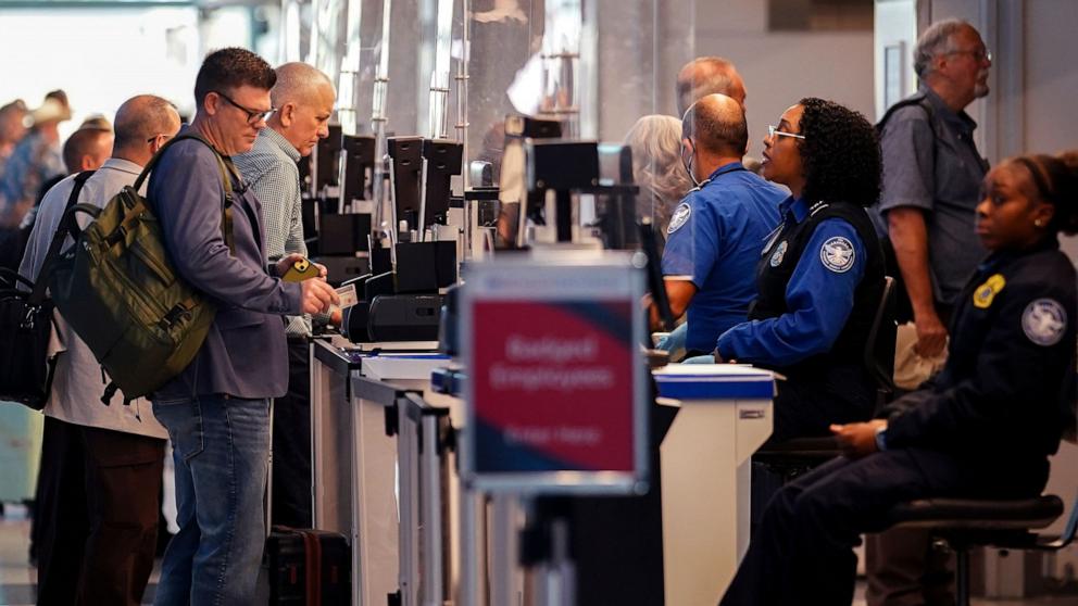 PHOTO: Passengers proceed through security checks at Ronald Reagan Washington National Airport in Arlington, Virginia, October 1, 2025.