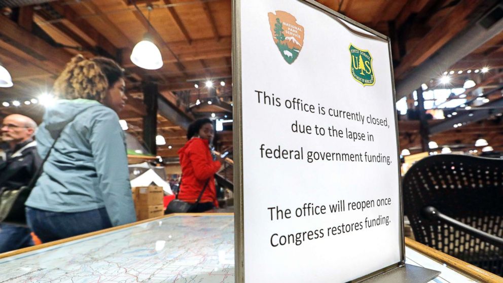 PHOTO: REI Co-op customers walk past an unstaffed ranger station kiosk, closed as part of the federal government shutdown, inside the flagship store in Seattle, Dec. 26, 2018.