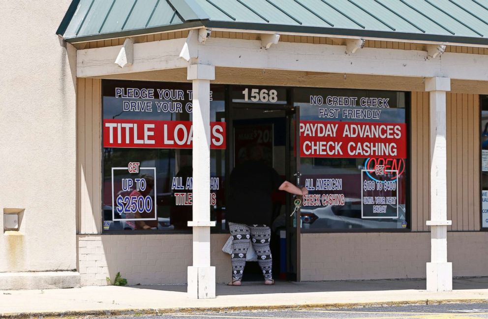 PHOTO: A woman enters a payday loan business in Brandon, Miss., May 12, 2017.