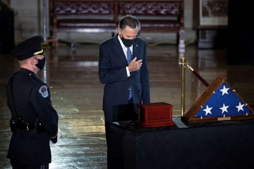 PHOTO: Sen. Mitt Romney pays his respects in front of the remains of U.S. Capitol Police Officer Brian D. Sicknick, 42, as he lies in state in the Rotunda of the U.S. Capitol, in Washington, Feb. 3, 2021.