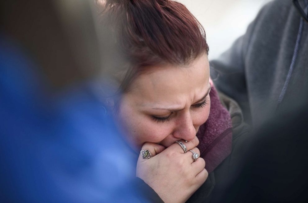 PHOTO: Sierra Kolarik, the sister of Chelsie Cline, one of the victims in a mass shooting at Ed's Car Wash, is comforted, Jan. 28, 2018 in Melcroft, Pa.