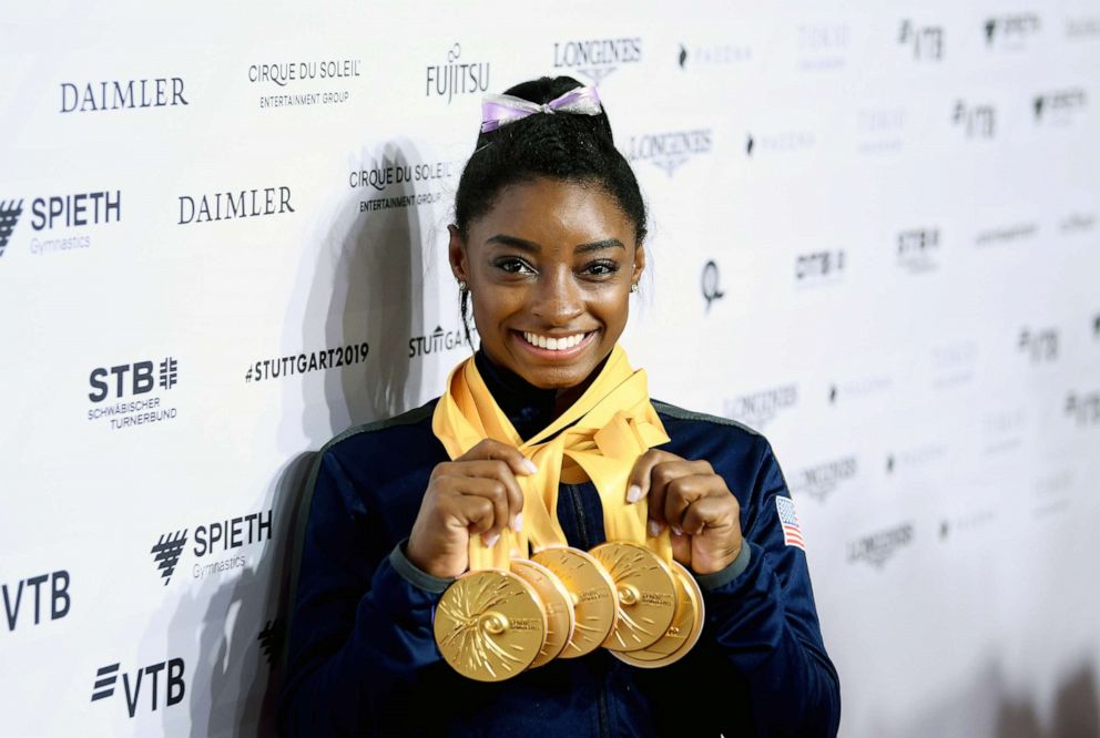 PHOTO: Simone Biles poses with her multiple gold medals during day 10 of the 49th FIG Artistic Gymnastics World Championships at Hanns-Martin-Schleyer-Halle, Oct. 13, 2019 in Stuttgart, Germany.