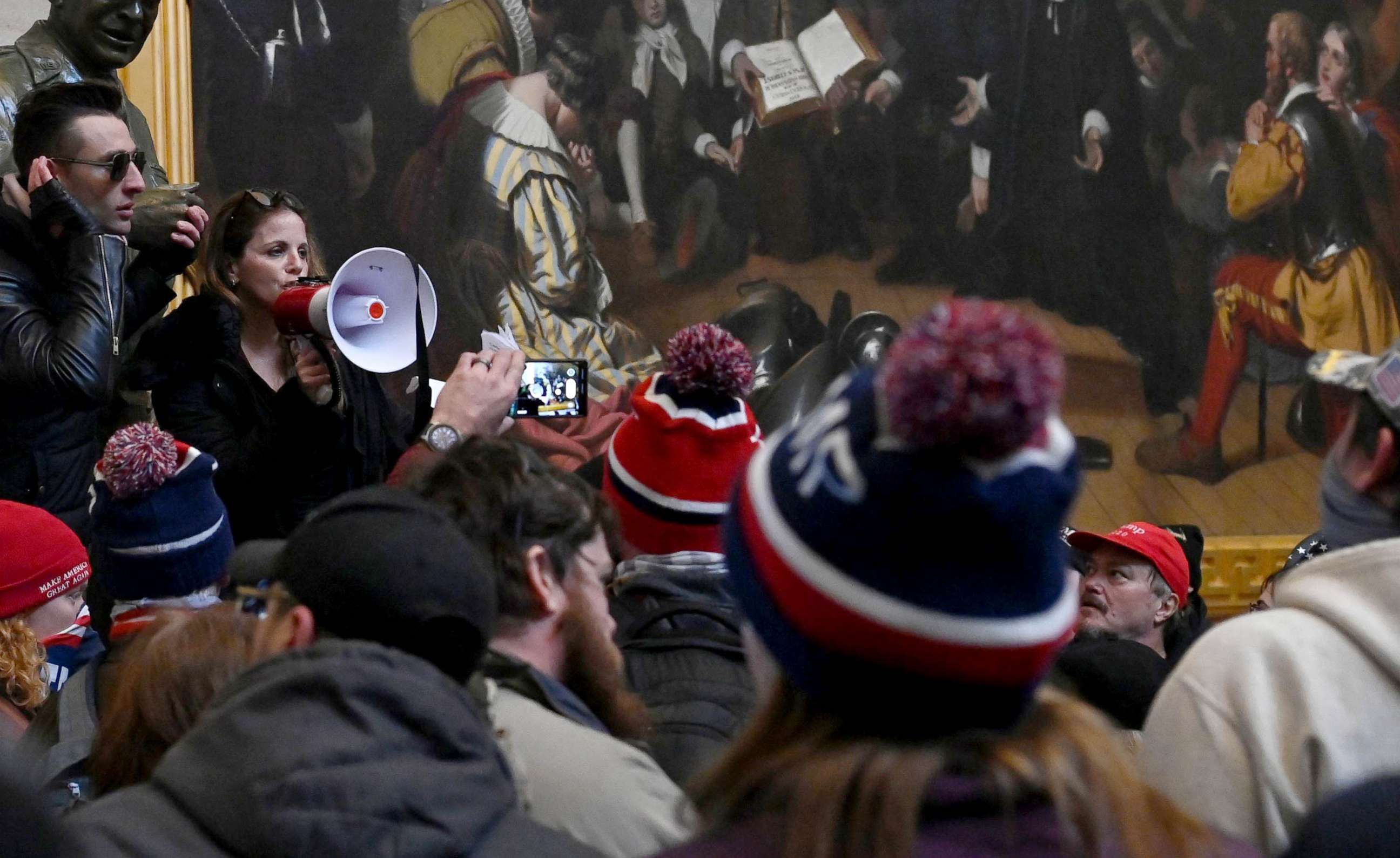 PHOTO: Dr. Simone Gold uses a bullhorn to address supporters of President Donald Trump during a riot in the US Capitol's Rotunda in Washington, Jan. 6, 2021.