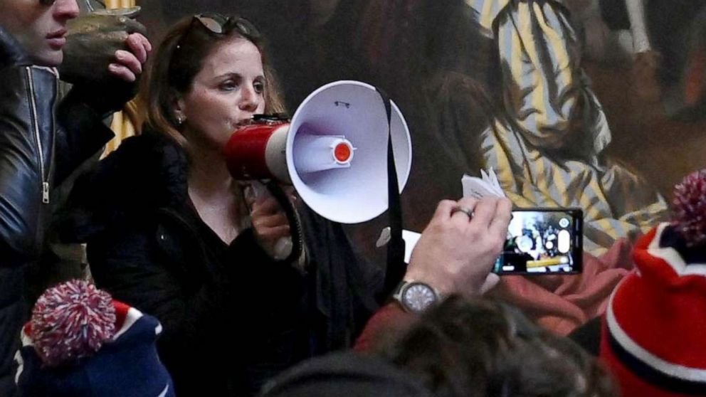 PHOTO: Dr. Simone Gold uses a bullhorn to address supporters of President Donald Trump during a riot in the US Capitol's Rotunda in Washington, Jan. 6, 2021.