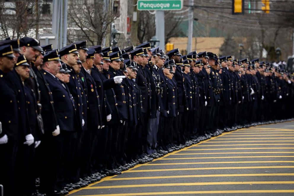 PHOTO: Officers line up on Montauk Highway as the funeral procession of fallen NYPD Detective Brian Simonsen leaves the Church of St. Rosalie, Feb. 20, 2019, in Hampton Bays, N.Y.