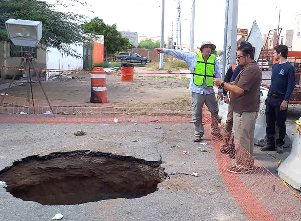 man in sinkhole