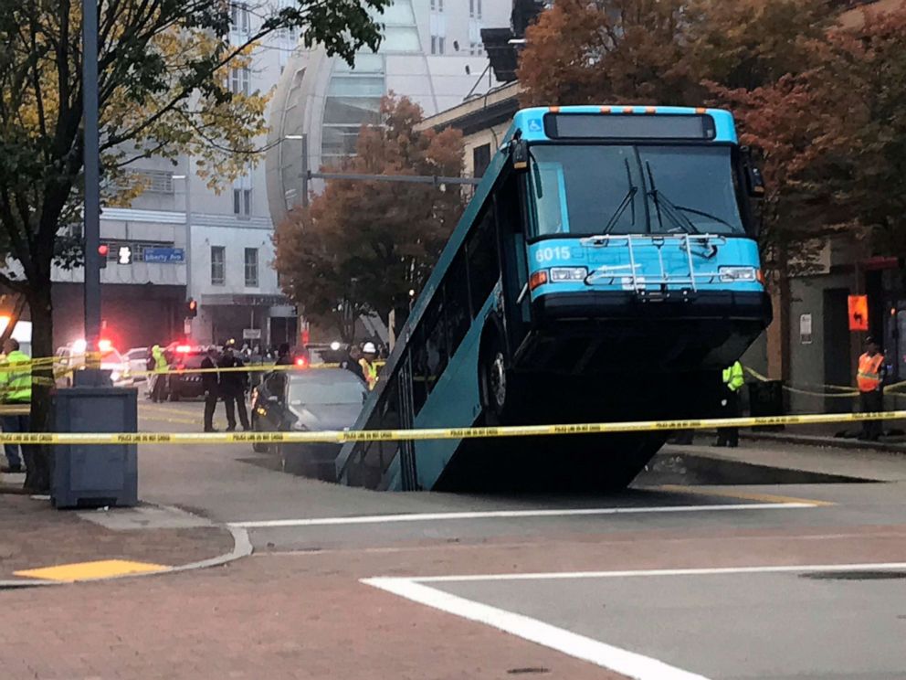 PHOTO: Authorities investigate after a Port Authority bus was caught in a sinkhole in downtown Pittsburgh, Oct. 28, 2019.