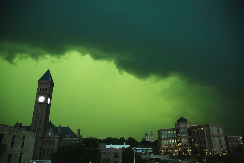 PHOTO: A storm creates a vibrant green sky over Sioux Falls, S.D., on July 5, 2022.