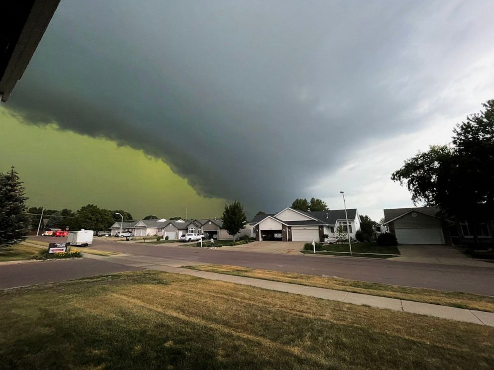PHOTO: A storm creates a green sky over southern Sioux Falls, S.D., on July 5, 2022.