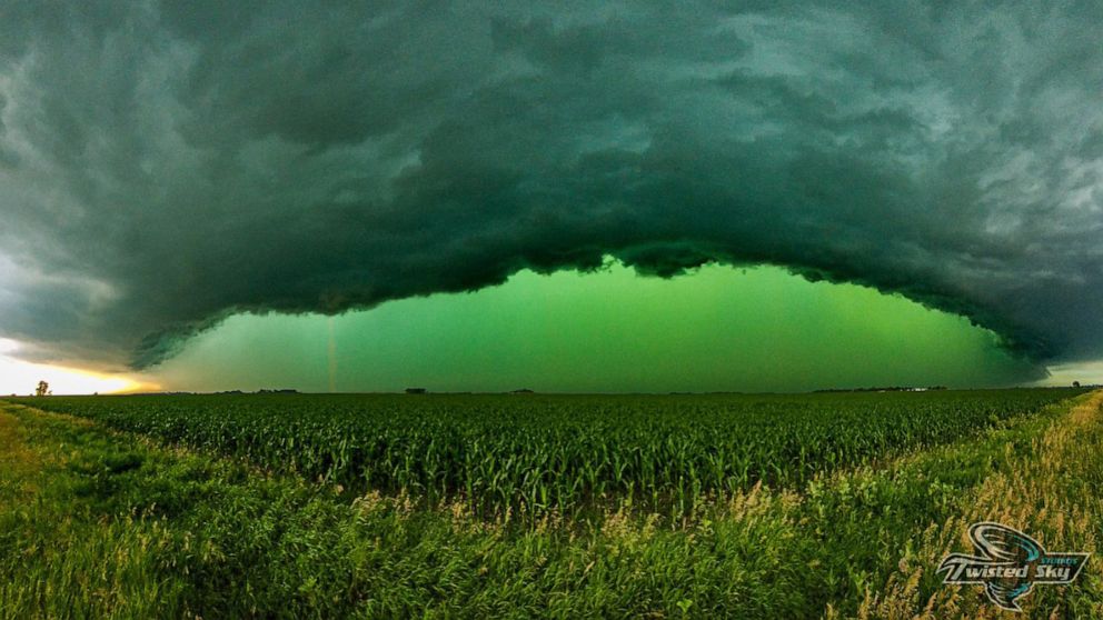 In this image obtained from social media, a storm turns the sky a vibrant green near Sioux Falls, S.D., on July 5, 2022.