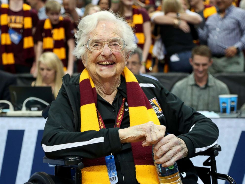 PHOTO: Sister Jean Dolores-Schmidt celebrates after the Loyola Ramblers beat the Tennessee Volunteers 63-62 in the second round of the 2018 NCAA Tournament at the American Airlines Center, March 17, 2018 in Dallas.