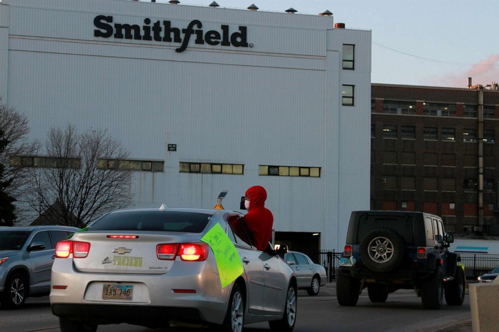 PHOTO: Employees and family members protest outside a Smithfield Foods processing plant in Sioux Falls, S.D., April 9, 2020.
