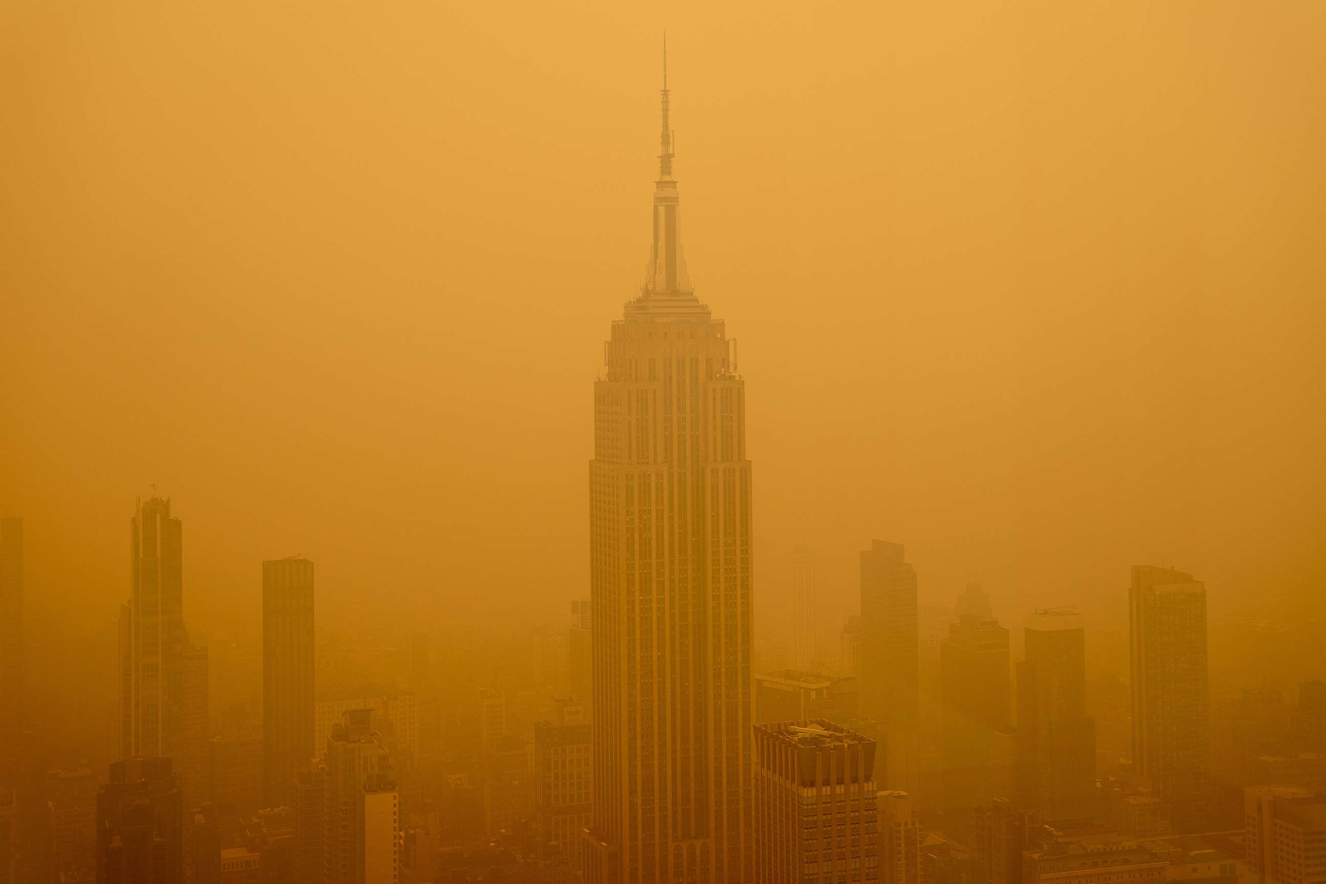 PHOTO: A smoky haze from wildfires in Canada diminishes the visibility of the Empire State Building, June 7, 2023, in New York.