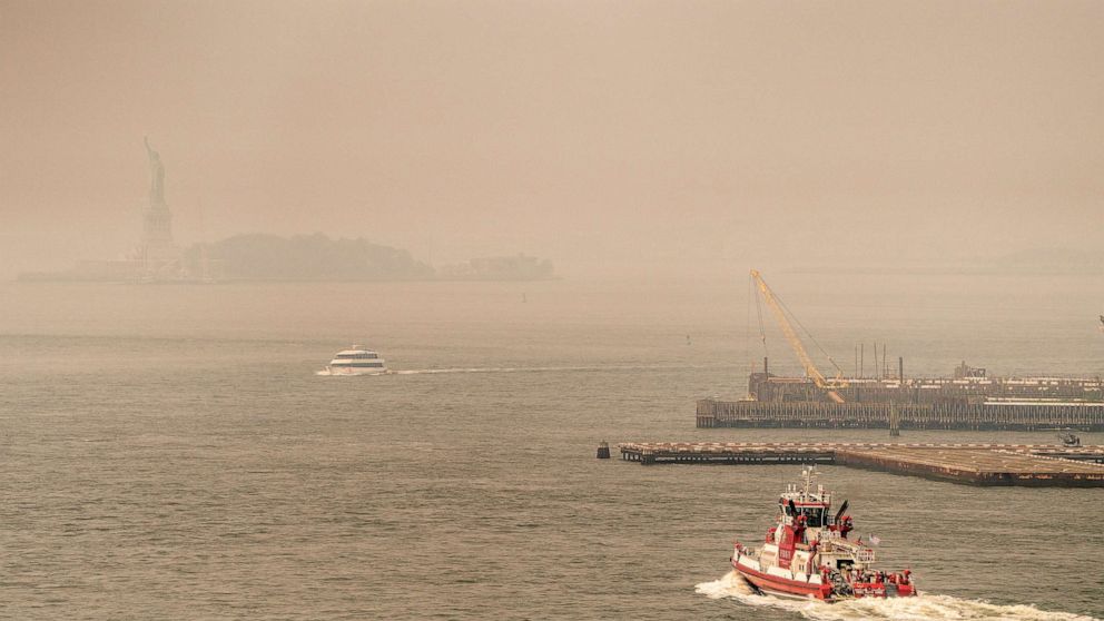 PHOTO: Smoke from wildfires in Canada shrouds the Statue of Liberty on June 30, 2023 in New York City.