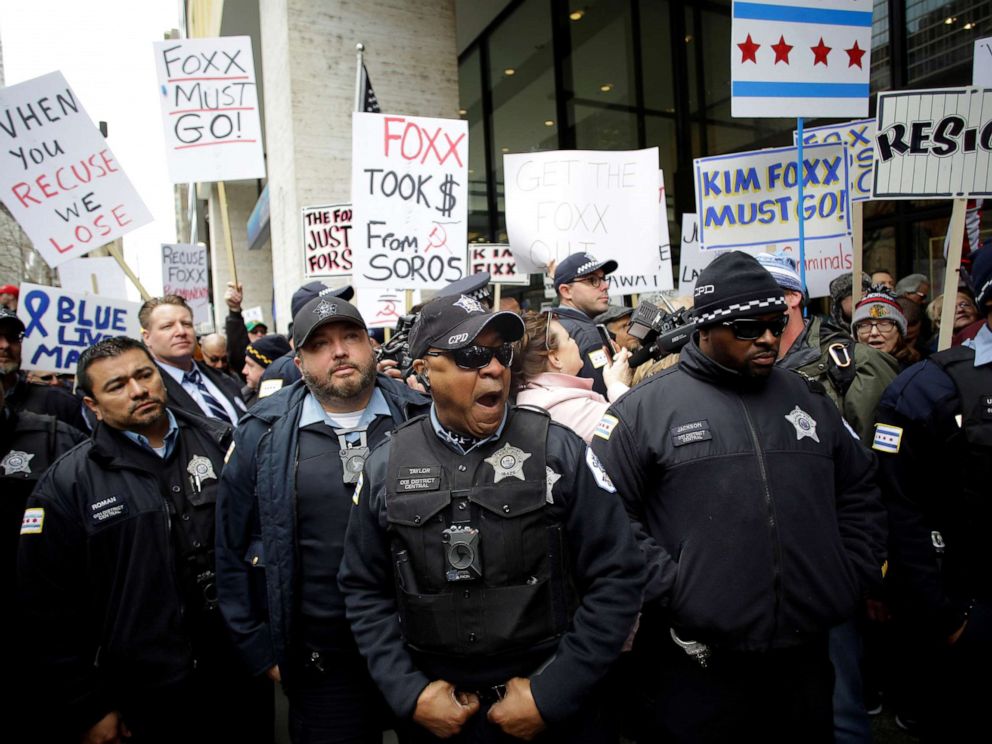 PHOTO:Chicago police officers stand in front of Fraternal Order of Police supporters protesting the handling of the Jussie Smollett case by the States Attorney Kim Foxx in Chicago, April 1, 2019.