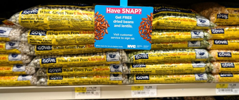 PHOTO: A sign at a grocery store informs customers of free food offers for participants of the Supplemental Nutrition Assistance Program (SNAP.)