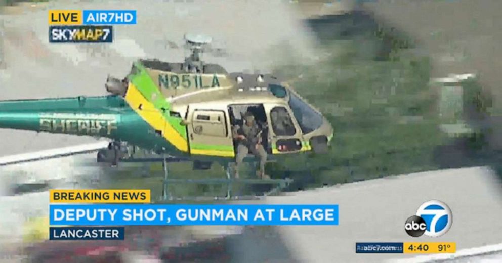 PHOTO: This Aug. 21, 2019 file image taken from KABC-TV video shows a sheriff's department helicopter with a sniper in an open door searching for a gunman at large in Lancaster, Calif.