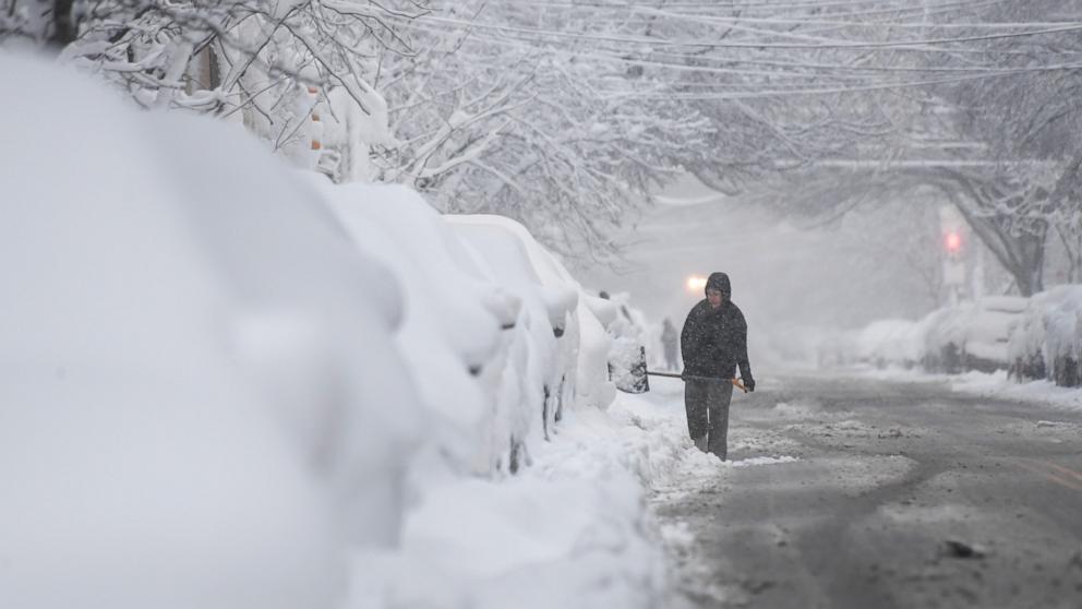 PHOTO: Residents dig out their cars as heavy snow continues to fall, February 23, 2026 in Philadelphia.