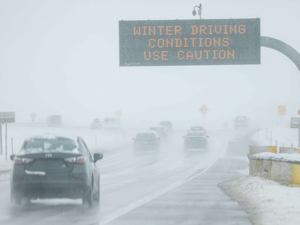 PHOTO: Drivers make their way along slick and snowy roads, Nov. 26, 2019, in Denver.