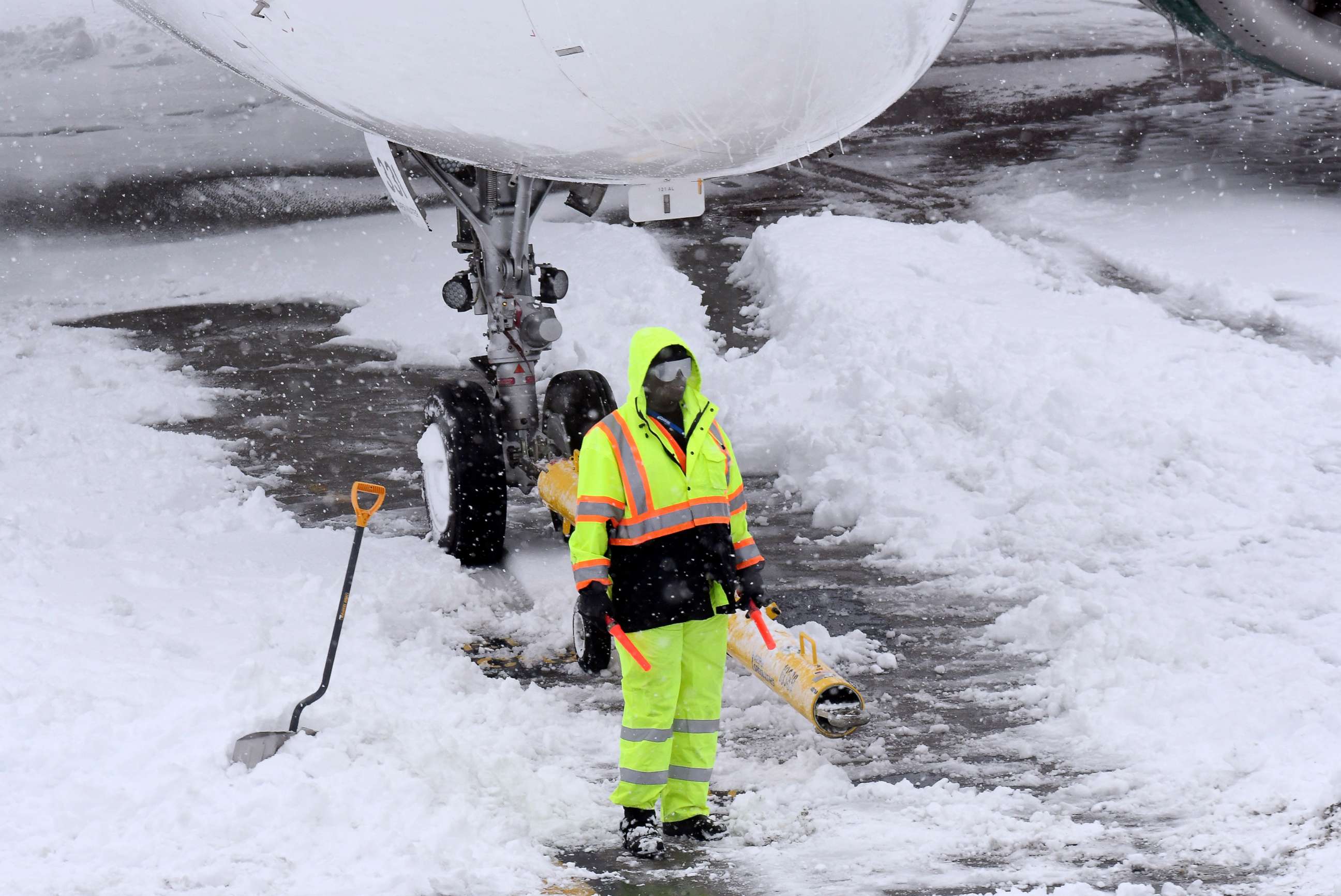 PHOTO:Ground crews remove snow from the airport tarmac as flights resume after an overnight snowfall, at the Albany International Airport in Colonie, N.Y., Dec. 2, 2019.