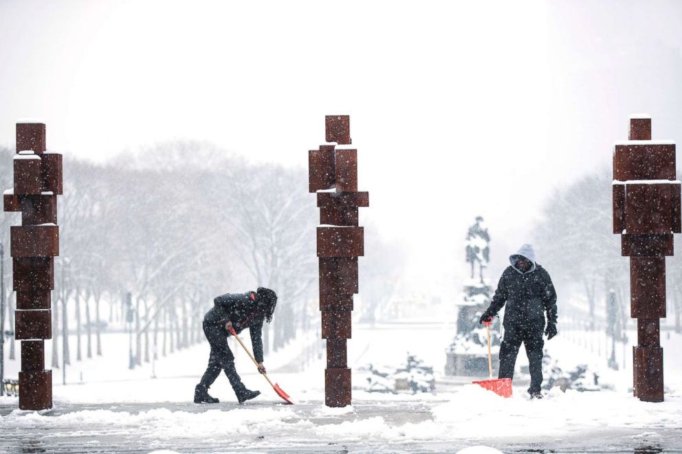 PHOTO: People shovel snow from the steps of the Philadelphia Museum of Art in Philadelphia, March 1, 2019.