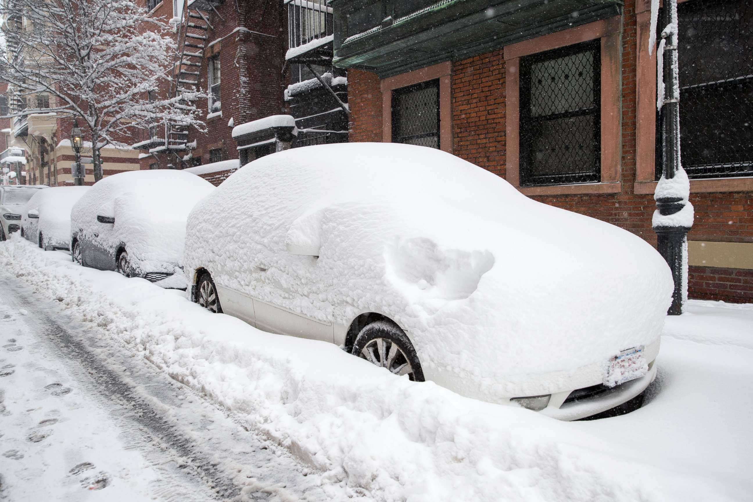 PHOTO: Snow covers cars on Spruce Street in Boston, Massachusetts, Dec. 17, 2020.